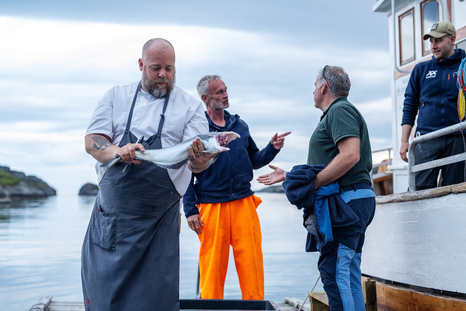 Chef collecting fresh fish from a local fishing boat